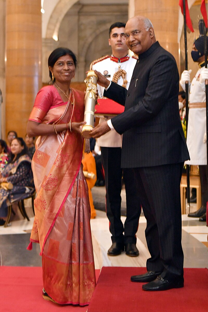 Kamal receiving Padma Shri from the President of India